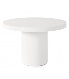 Mesa redonda ibicenca de microcemento blanco estilo mediterráneo.