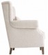 Sillón orejero grande tapizado en chenilla blanco roto clásico 2