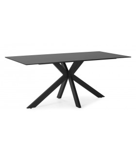 Mesa fija de comedor sobre cerámico negro base metálica en aspa.