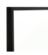 Espejo rectangular alto de metal negro con diseño industrial sobrio.