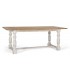 Mesa XL de comedor en madera natural y patas blancas torneadas.