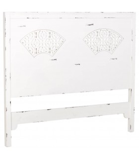 Cabecero de cama blanco rozado con calados decorativos orientales.