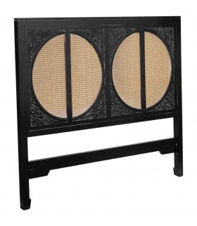 Cabecero oriental de madera negra y ratán para cama de matrimonio.