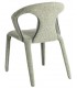 Silla tapizada en chenilla verde claro con diseño curvo y cómodo.3